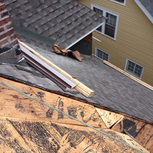 Roofing contractor installs new roofing in Mattapan, MA