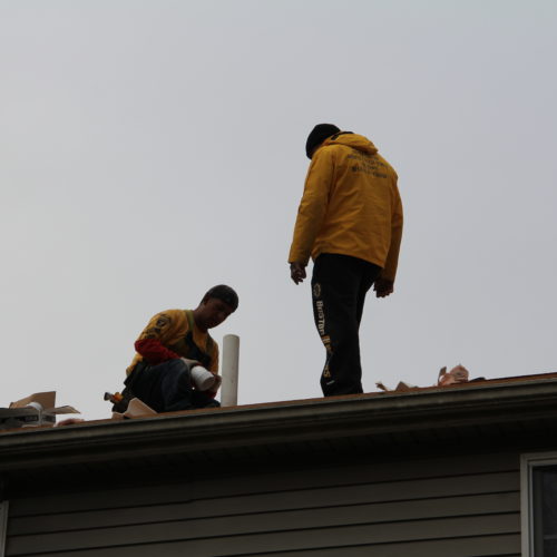 Roofing technicians installing new roof in taunton