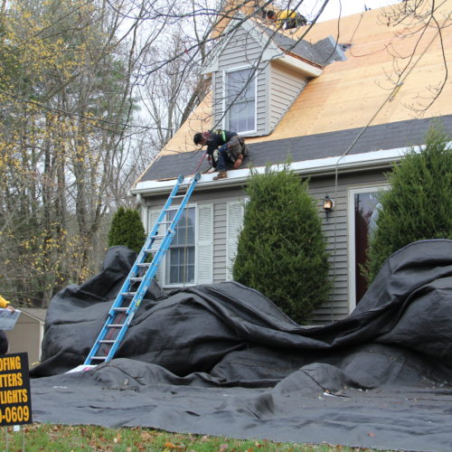 Installing new roofing shingles in tauntonma